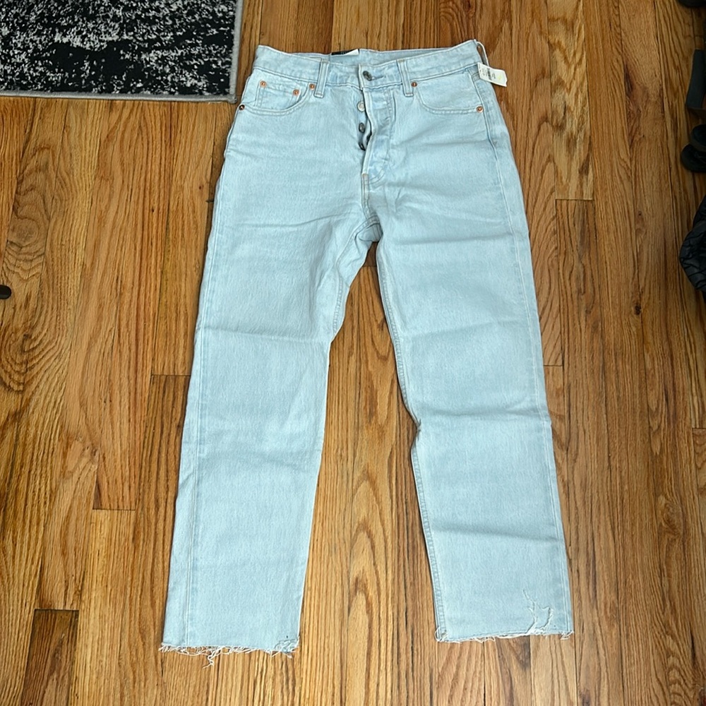 NEW WITH TAGS.  light wash cheeky straight high rise jeans